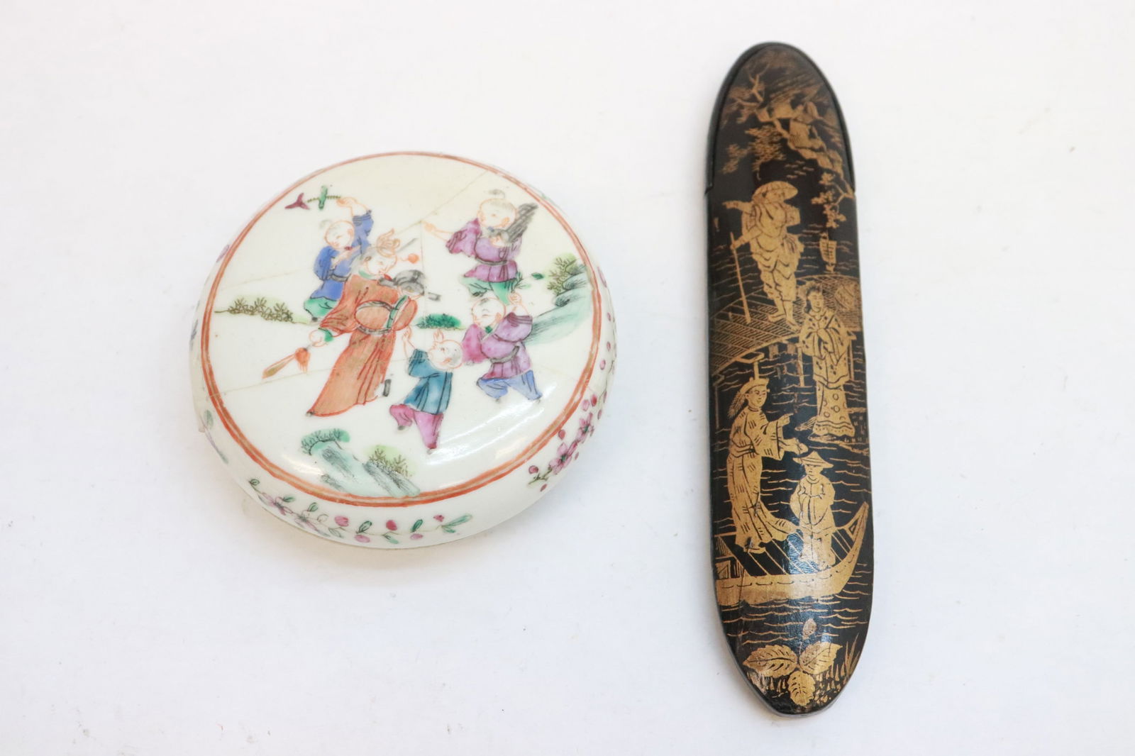 famille rose box, & an antique lacquer eye glasses case: 2 pieces; famille rose box (repair) (1.6"x3.4"dia), and an antique lacquer eye glasses case (no glasses) (6.65"x1.4"x0.6")