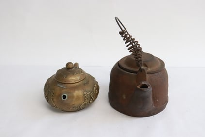 a b&w teapot, and a purple glazed porcelain jar