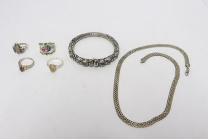 4 sterling rings, one sterling necklace, & a silver bangle