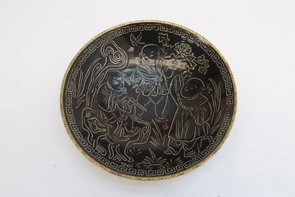 A brown glazed porcelain bowl