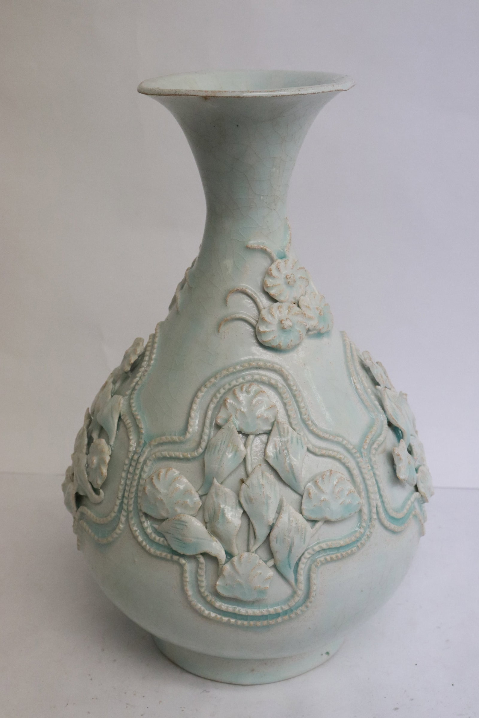 Chinese celadon porcelain vase: Chinese celadon porcelain vase with decoration in relief, 9.65"x6.4"dia