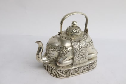 A white bronze teapot in the form of elephant