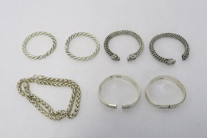 6 white metal bangles, & a white metal necklace