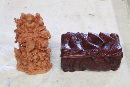a wood carving, and a wood carved box