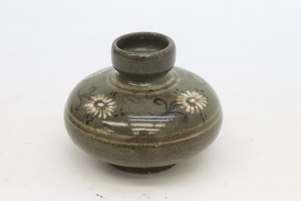 A small Korean celadon jar