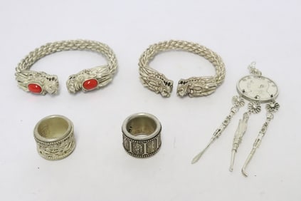 5 white metal articles