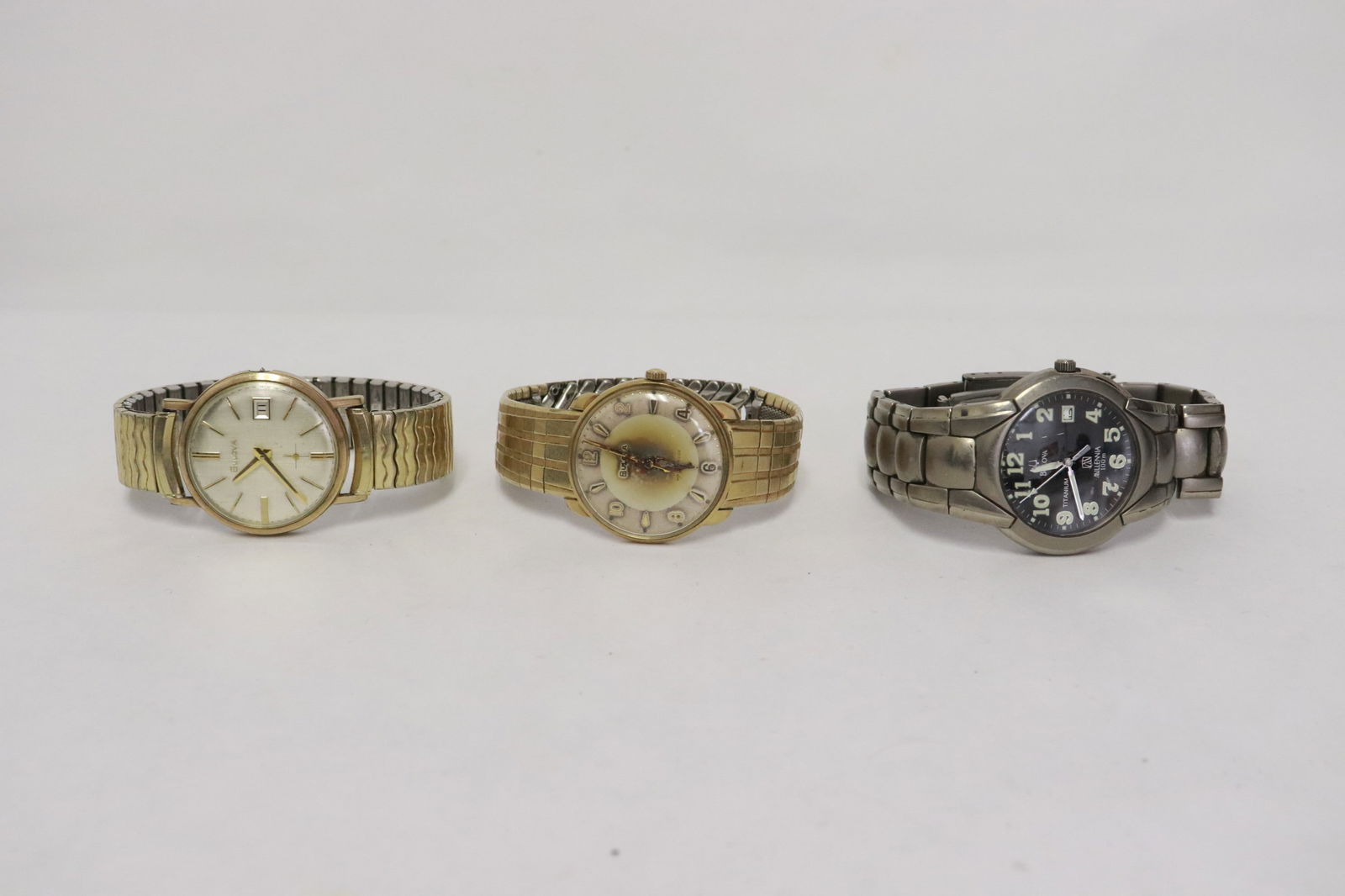 3 men's Bulova watches: 3 men's Bulova watches; one missing crown, one is titanium millennia 100 meter diver watch