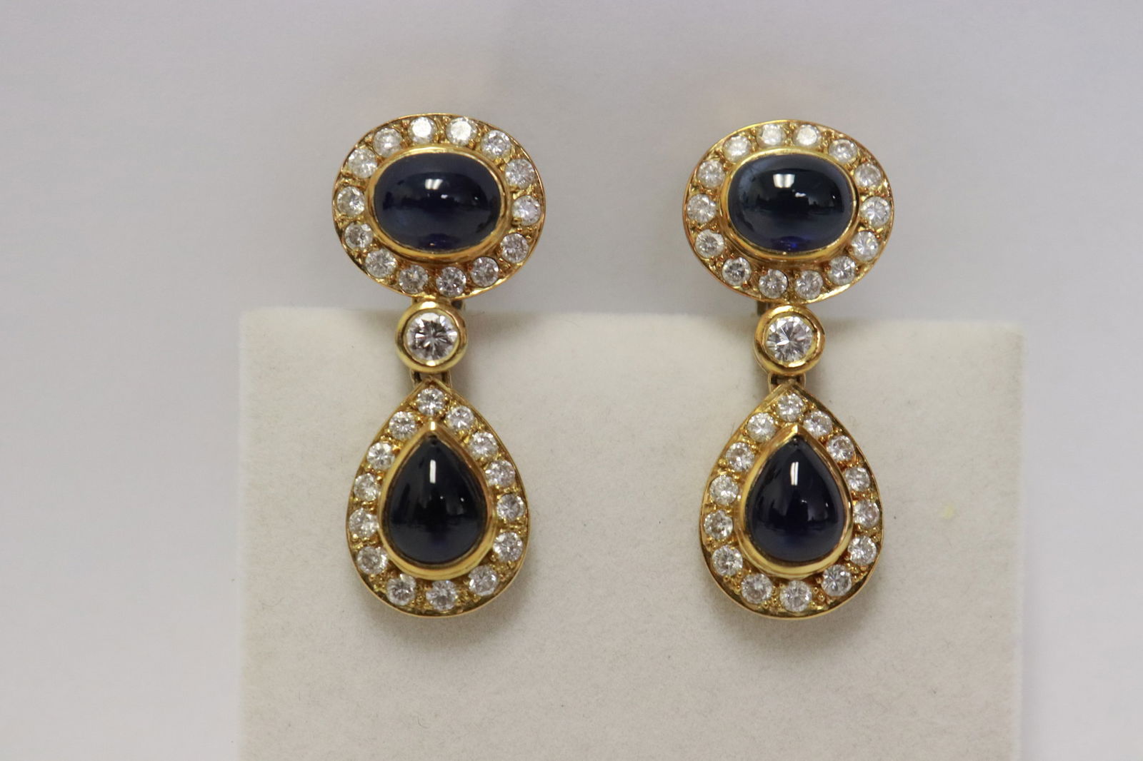 Pair 18K sapphire diamond earrings w/ GIA certificate: Pair 18K rose gold sapphire diamond earrings, each set with 2 natural blue sapphires with Thailand origin (GIA certificate) oval cabochon wt approx. 4.40ct each (by formula), and pear cabochon wt.