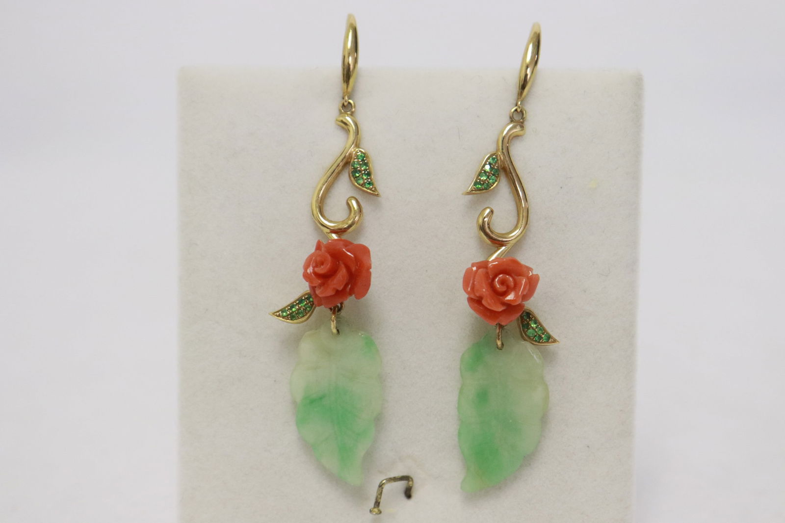 Pair 18K Y/G jadeite and coral earrings: Pair 18K Y/G jadeite and coral earrings set with 2 leaf shape antique light apple green jadeite measures approx 21.5x12.5mm, and 2 fine red coral carved flowers, wt. 7.7gm, NO INTERNATIONAL SHIPPING