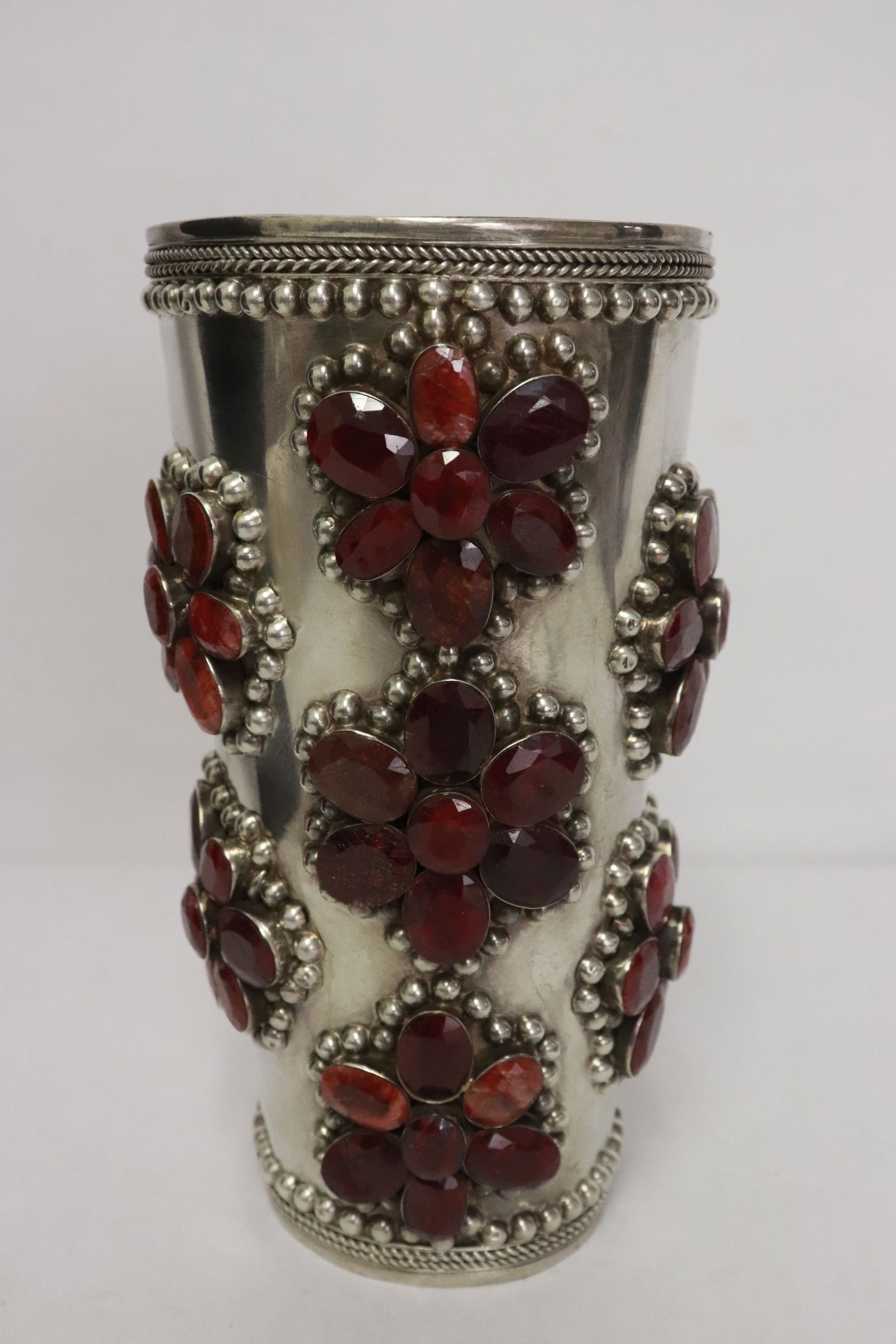 A rare sterling ruby cuff: A rare sterling cuff set with 49 genuine rubies, total ruby wt. approx. 250ct, wt. 342gm, 6.8"x3.6"dia