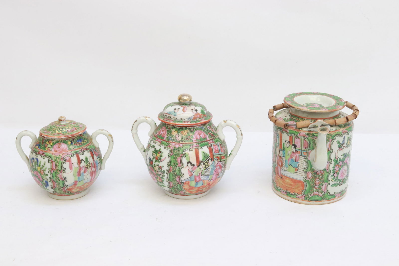 3 pieces antique rose canton porcelain: 3 pieces antique rose canton porcelain; a teapot (5.25"x6"x4.5"), and 2 covered sugars (4.65"x5.35"x4", 5.7"x6.2"x4.6")