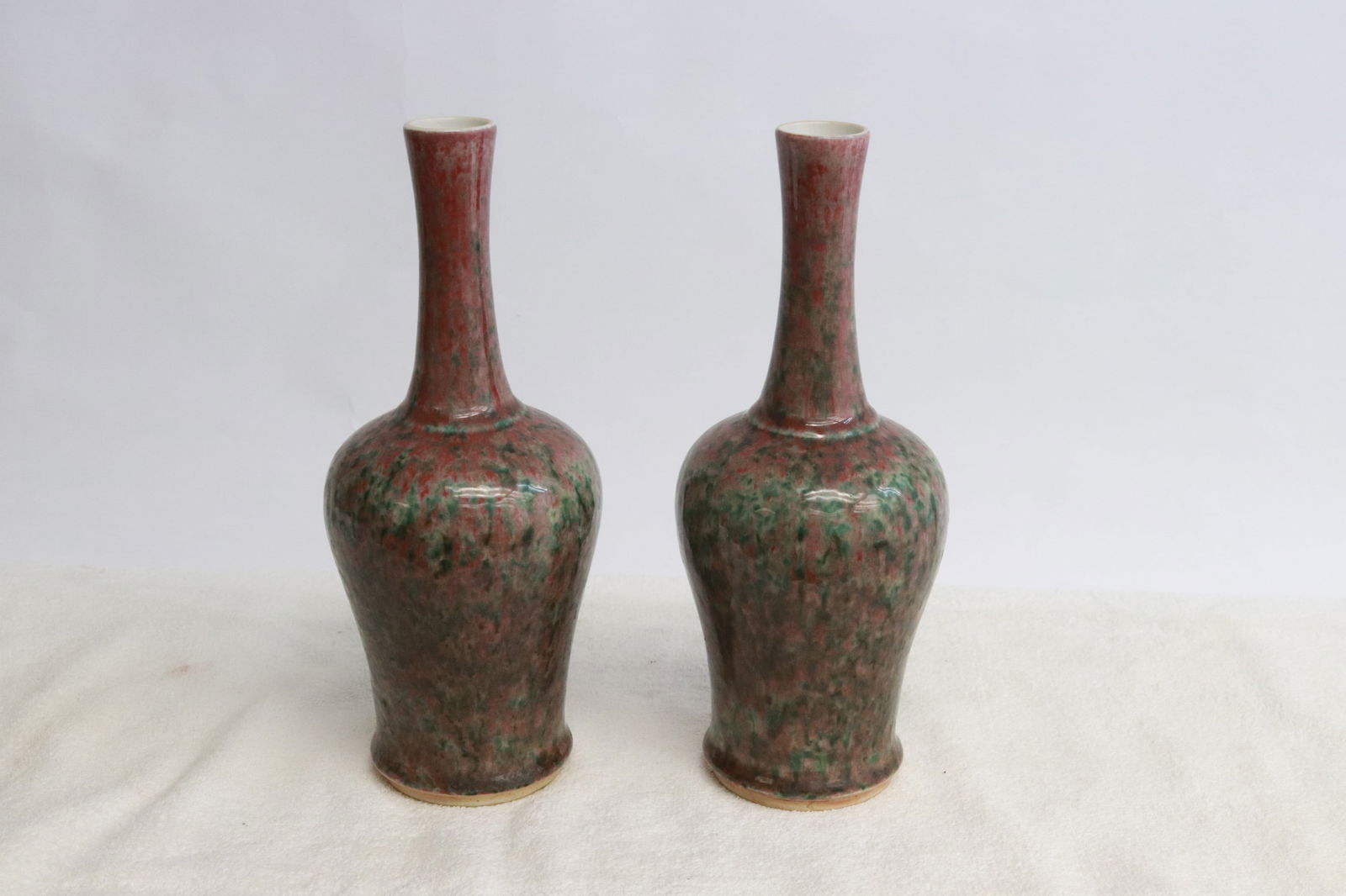 Pair Chinese green on purple porcelain vases: Pair Chinese green on purple porcelain vases, 9.2"x3.8"dia ea
