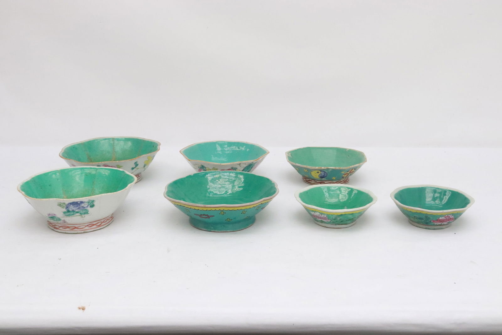 7 Chinese antique famille rose bowls: 7 Chinese antique famille rose bowls, edge flea bites, 1.65"x4.75"x4.75" - 2.4"x7.35"x7.35"