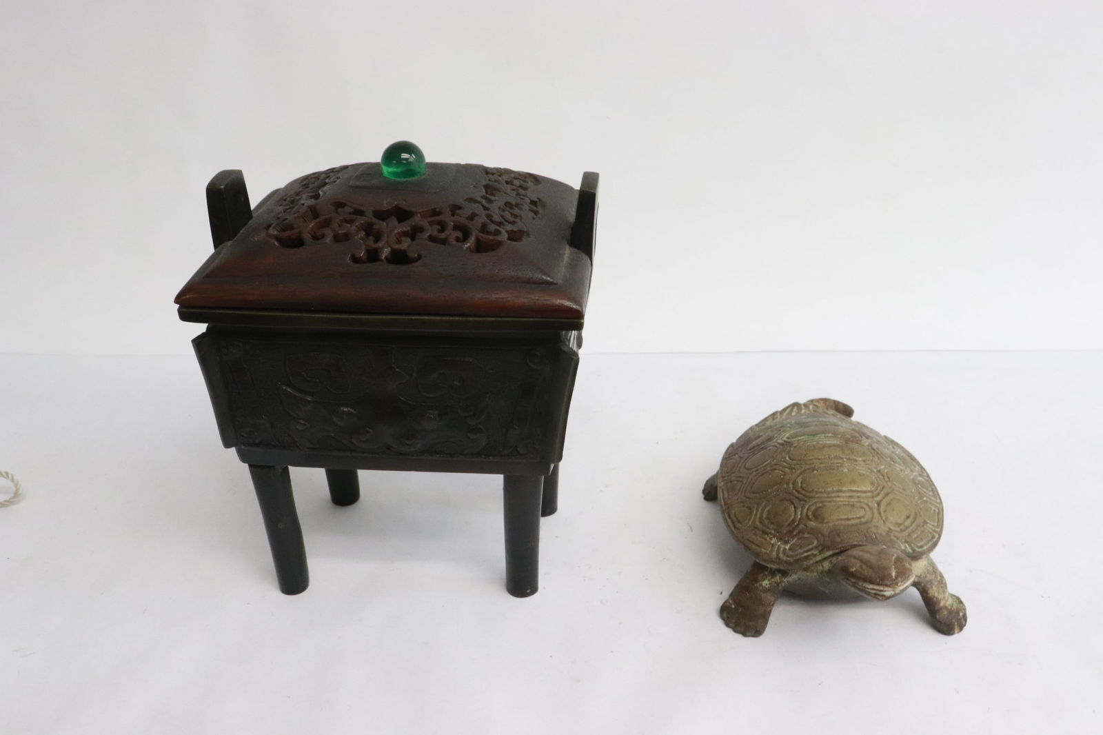 a bronze censer w/ wood cover, and a bronze censer: 2 pieces; archaic style bronze censer with wood cover (6.4"x5.1"x3.85"), and a bronze censer in the form of turtle (2.15"x6.35"x3.4")