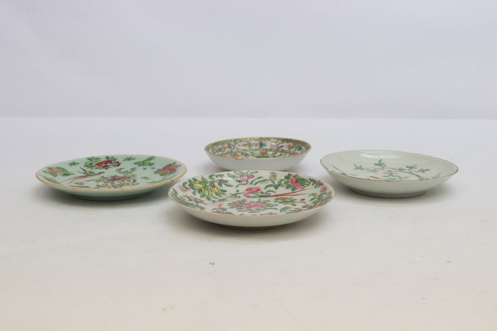 an 18th/19th c. porcelain plate, & 3 antique small plates: 4 pieces (1"x4.65"dia - 0.75"x5.75"dia); an 18th/19th century famille rose plate (edge small chip), and 3 antique famille rose porcelain small plates (one has small edge chip)