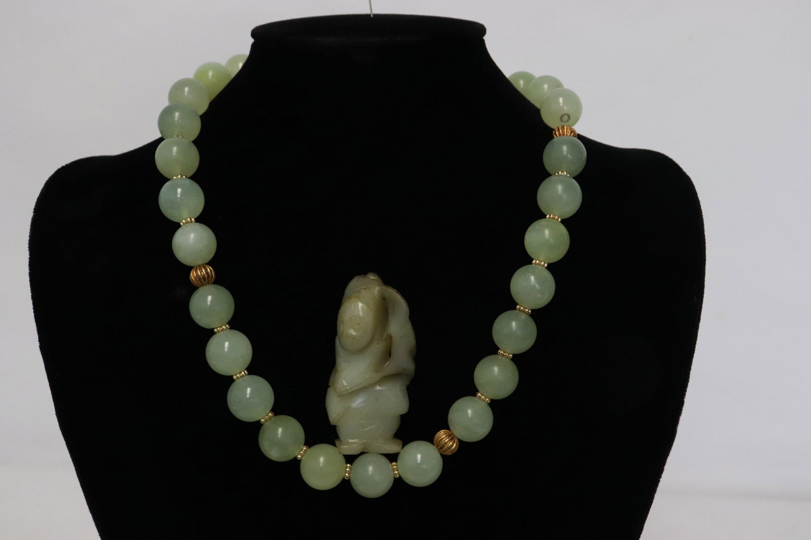 a celadon jade carving, & a jade like bead necklace (1 of 11)