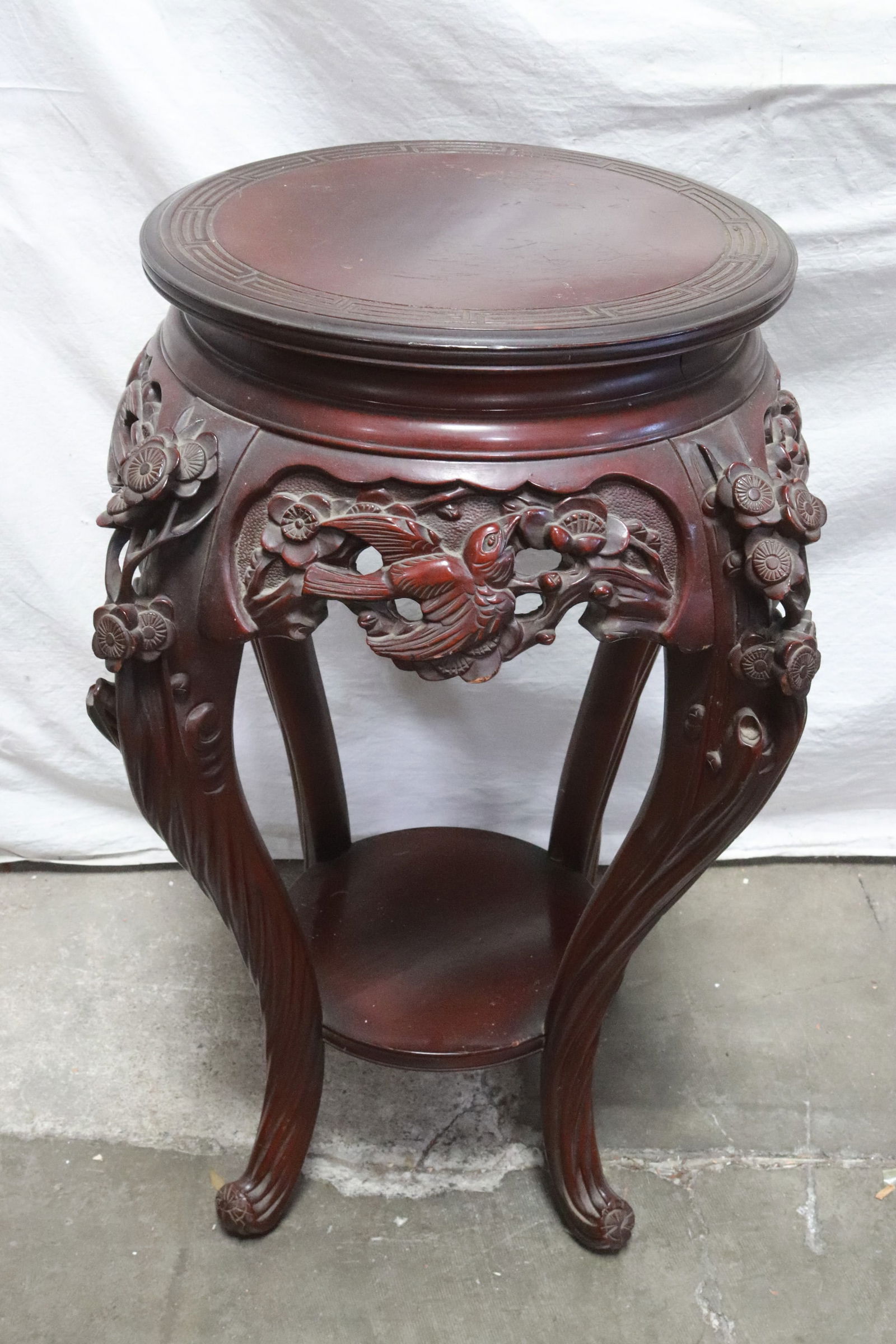 Finely carved round pedestal stool (1 of 9)