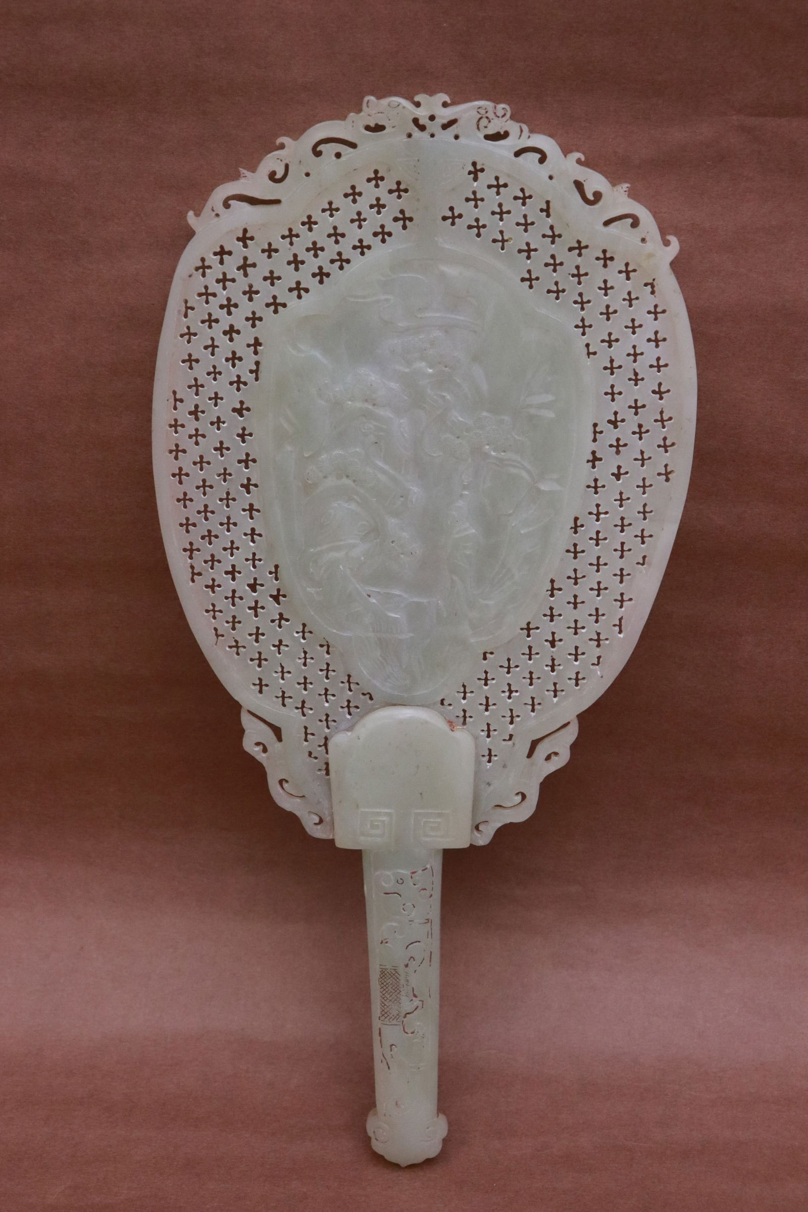 Chinese celadon jade carved fan: A beautiful Chinese celadon jade carved fan, panel decorated with plume tree motif in relief, a beautiful example, 11.15"x5.35"x0.65"