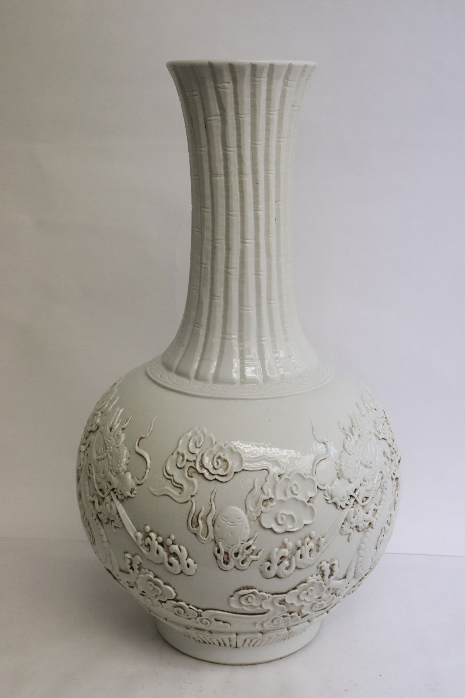 A Chinese white glazed & carved porcelain bottle vase (1 of 9)