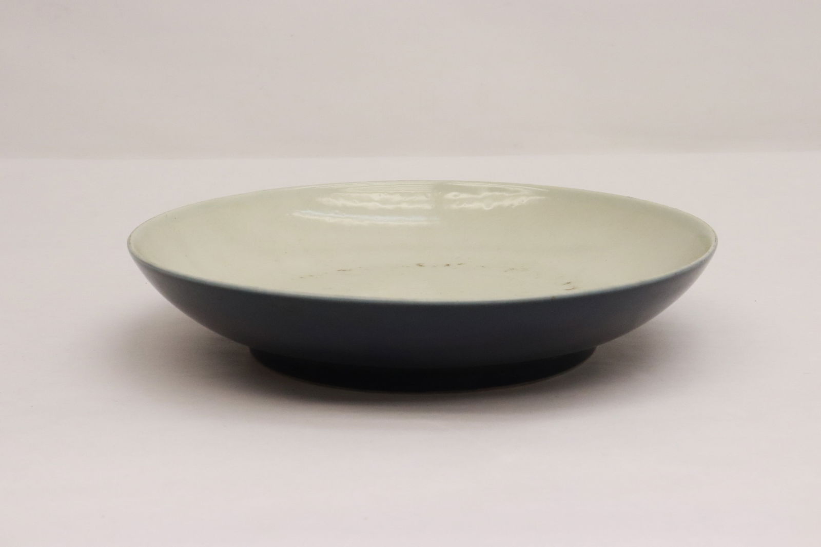 A celadon and blue glazed porcelain plate: A celadon and blue glazed porcelain plate, 1.85"x8.8"dia