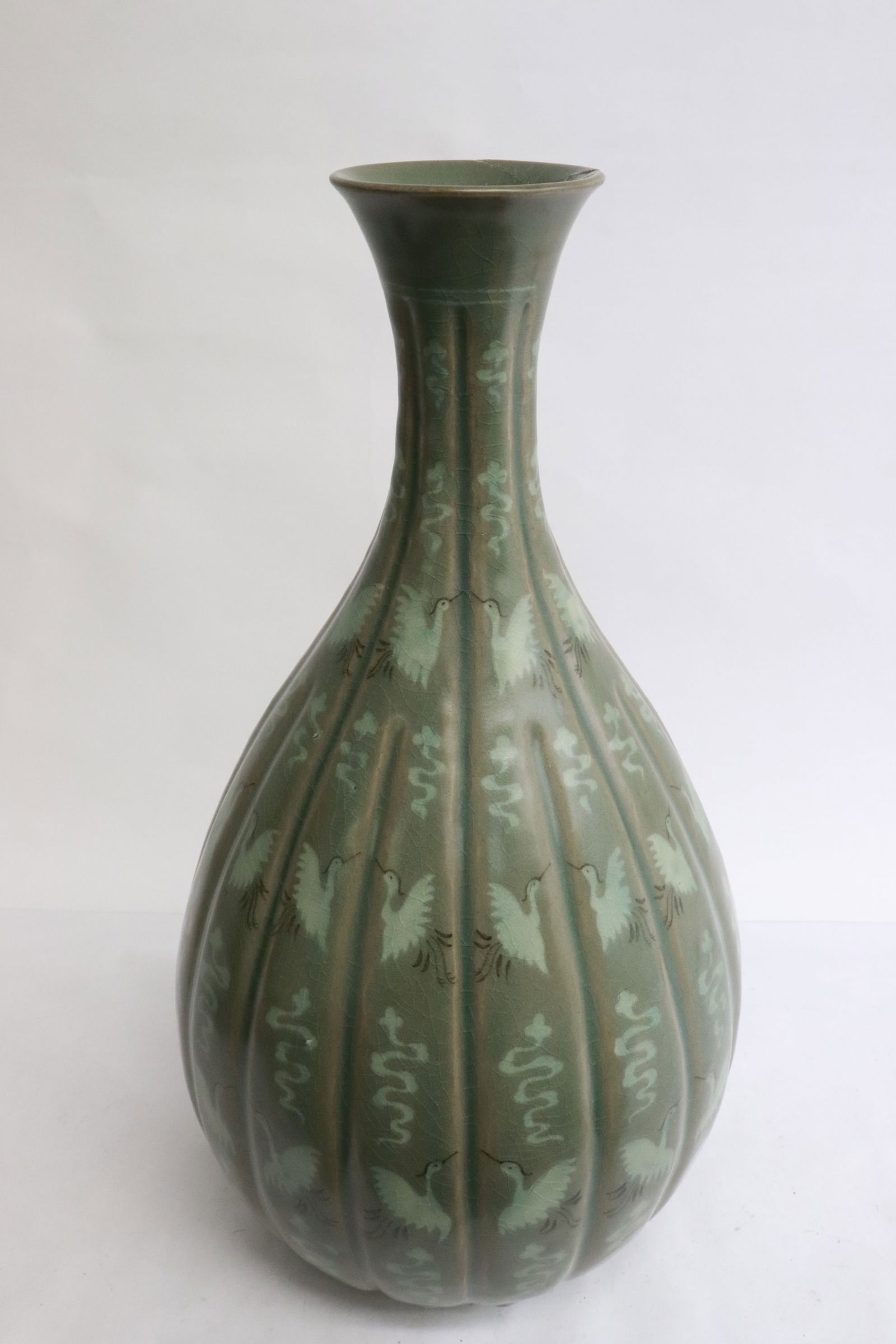 A large celadon on celadon porcelain vase: A large celadon on celadon porcelain vase, 14.2"x7.7"dia