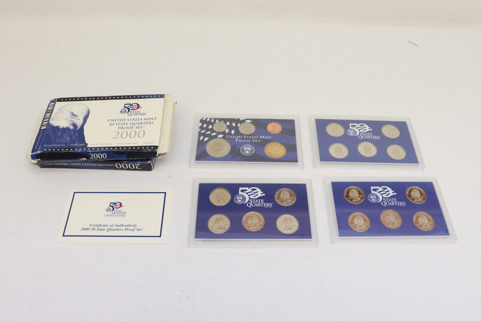 three 2000 quarter proof sets, & a 2000 dollar proof set (1 of 10)
