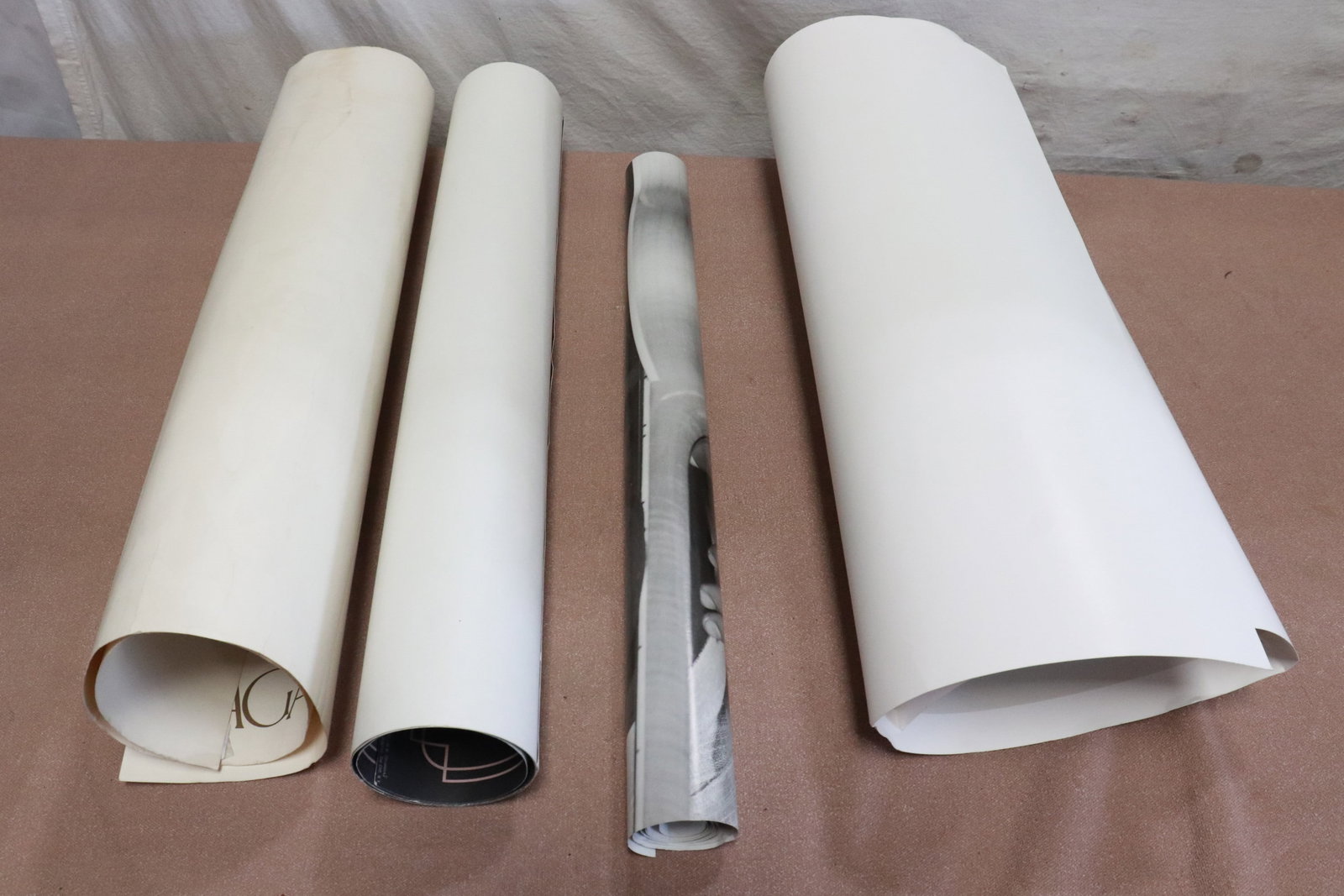 a signed etching, and 3 posters: 4 pieces (22.8"x31.5" - 39"x24.7"); a signed etching, and 3 posters