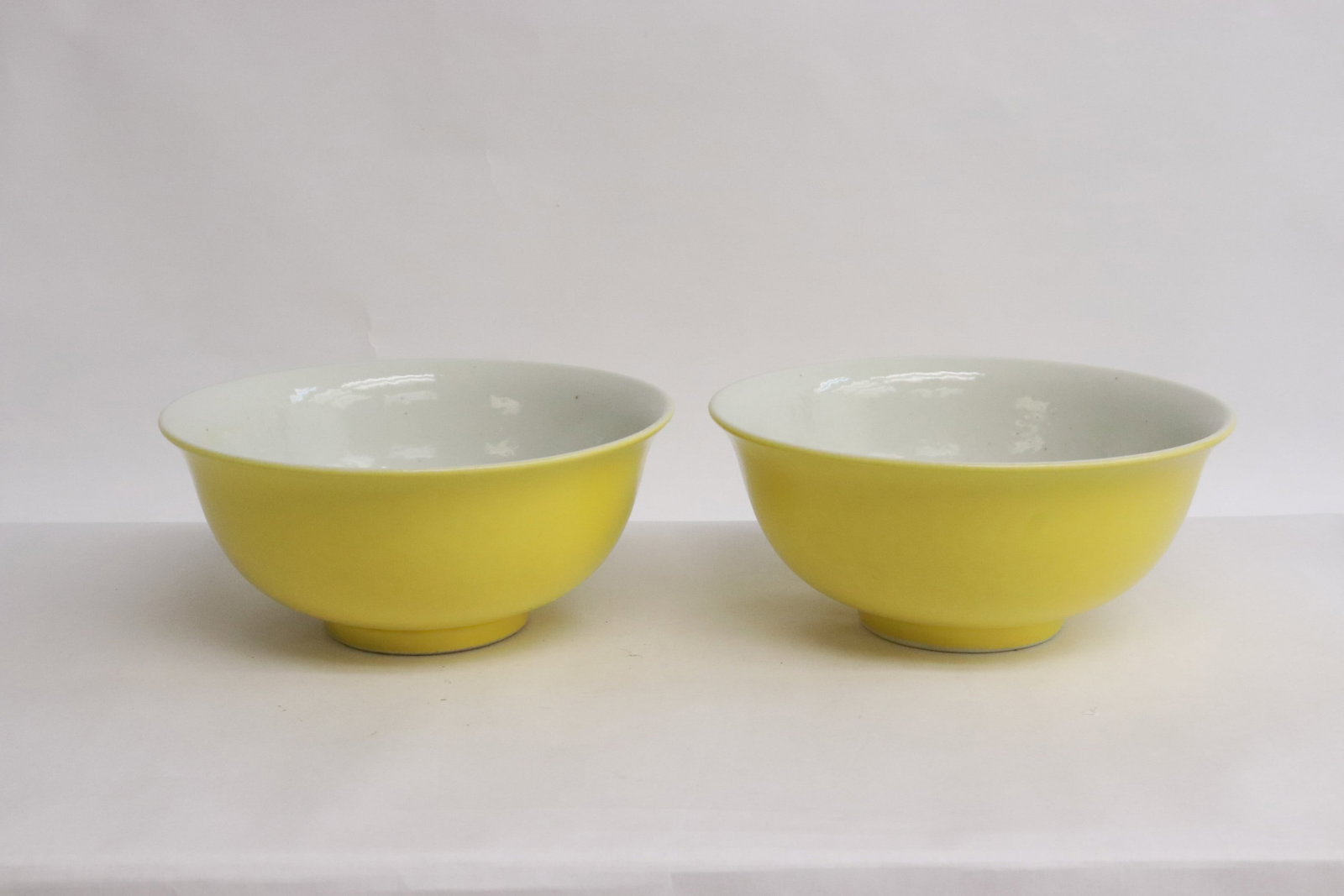 Pair Chinese yellow glazed porcelain bowls: Pair Chinese yellow glazed porcelain bowls, 2.8"x6.25"dia ea