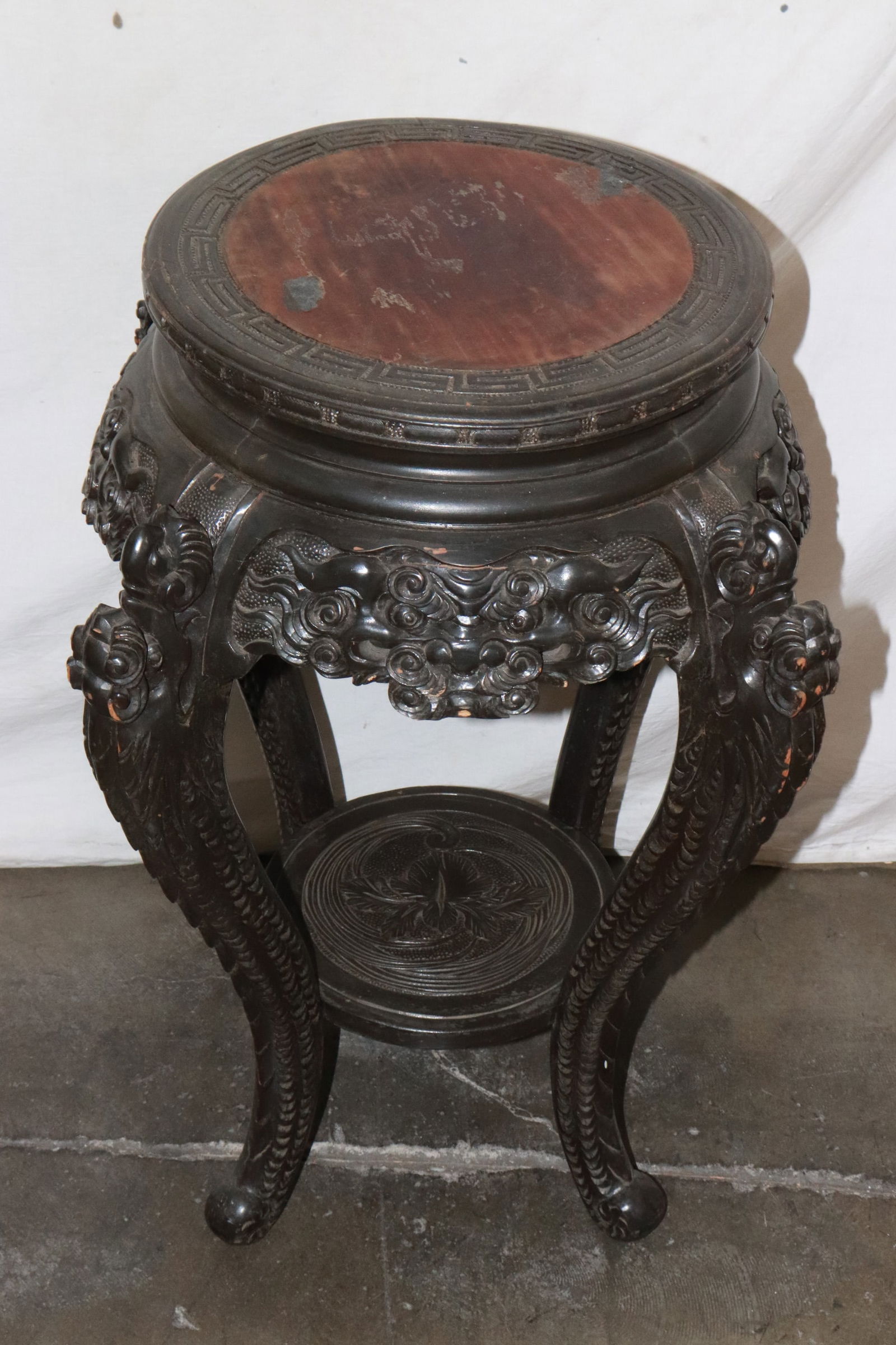 A wood carved round pedestal stand (1 of 8)