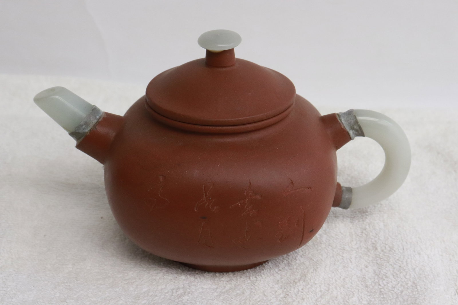 Chinese Yixing teapot with jade like spout & handle: Chinese Yixing teapot with jade like spout and handle, 3.85"x6.3"x4"
