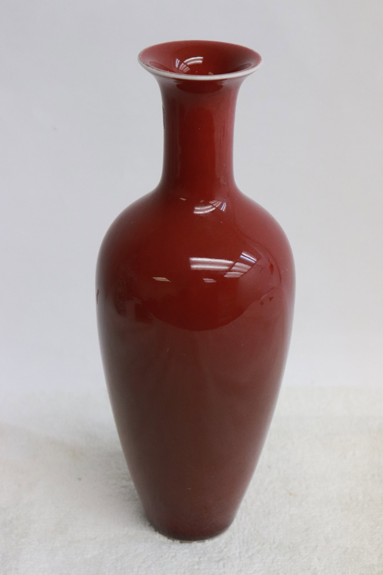 A red glazed porcelain vase (1 of 6)