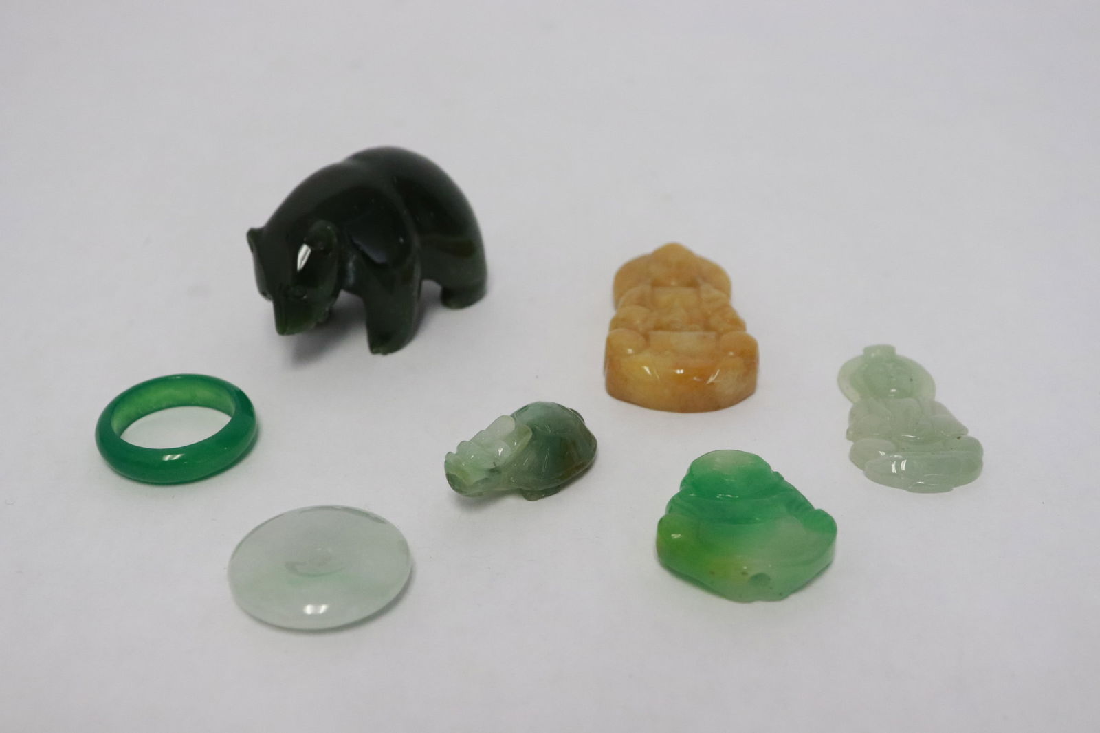 7 jade like carved ornaments: 7 jade like carved ornaments, 0.5"x1.2"x0.7" - 1.3"x1.95"x1.15"