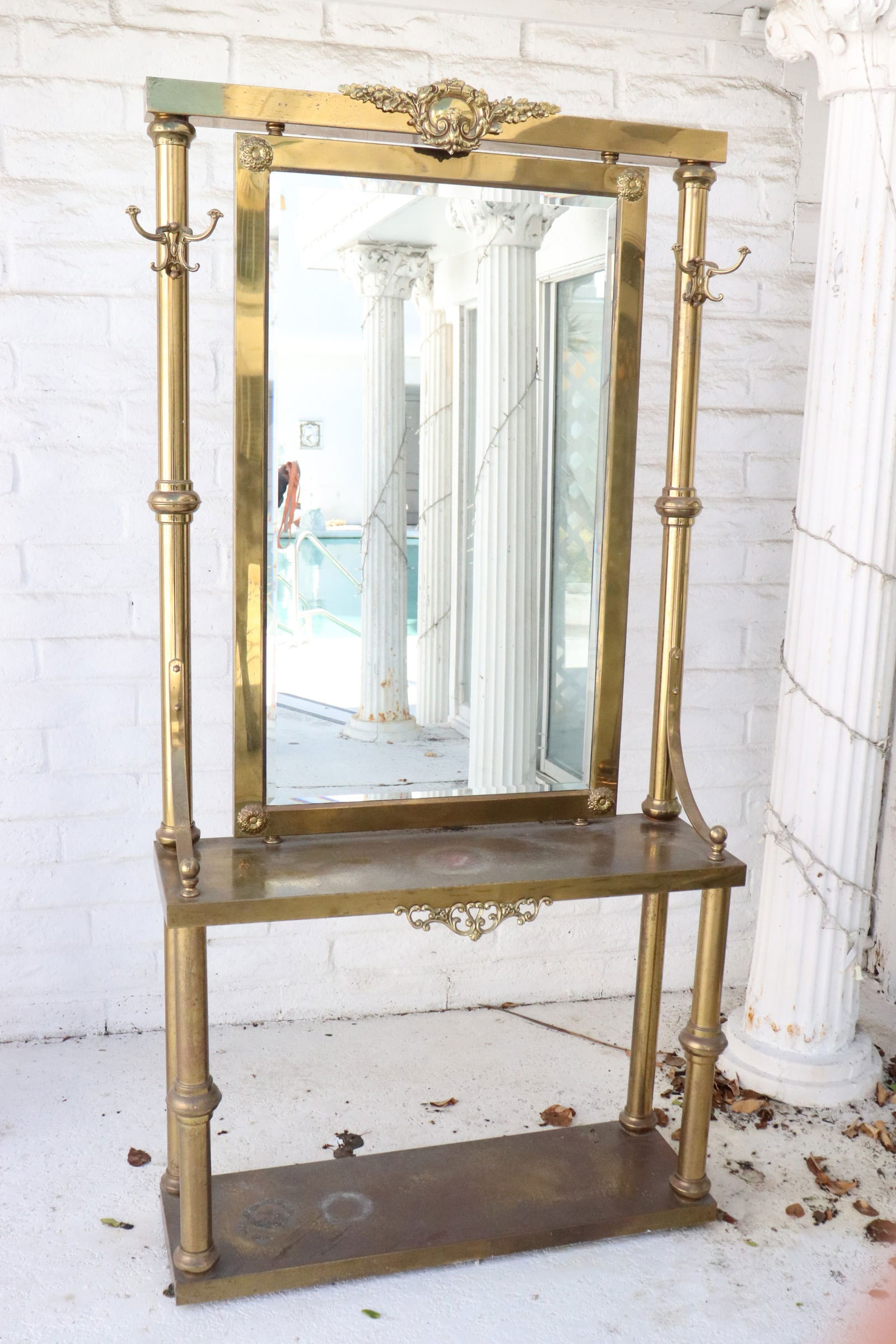 An early 20th c. brass hall console w/ beveled mirror: An early 20th century brass hall console with beveled mirror, 76.85"x39.2"x12"