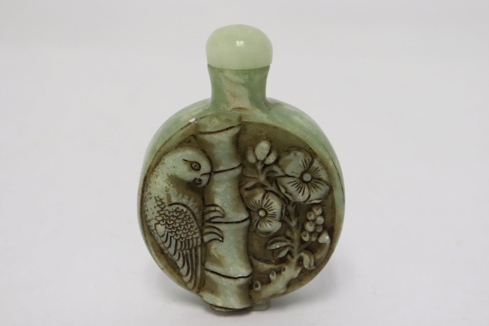 A green stone carved snuff bottle (1 of 6)