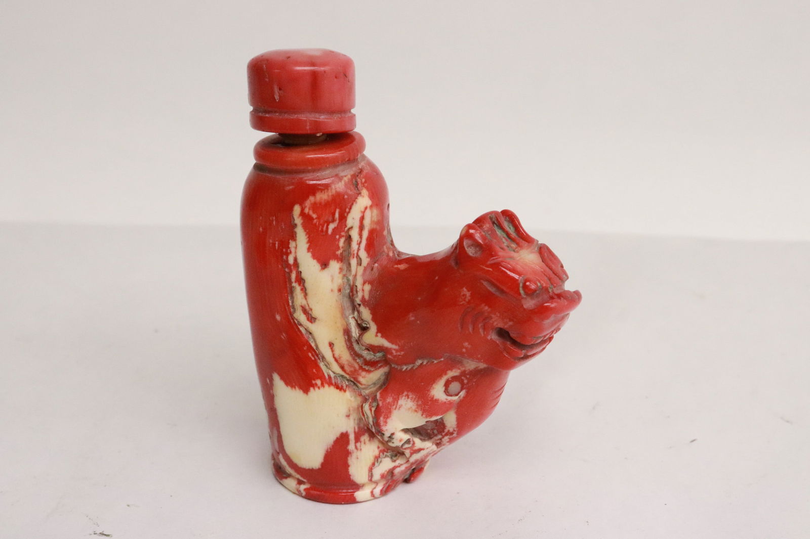 Coral like stone carved snuff bottle: Coral like stone carved snuff bottle, 3.35"x2.65"x1.2"