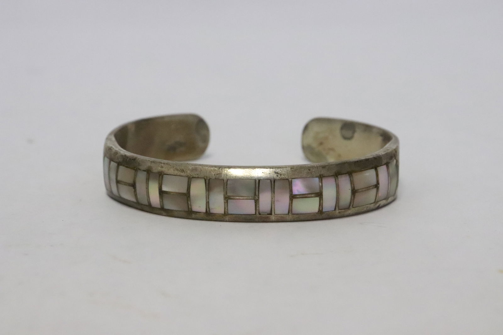 sterling cuff by Zuni artist Tsadiase with MOP: Rare sterling cuff by Zuni artist Tsadiase with mosaic setting of mother of pearl, wt. 22.6gm
