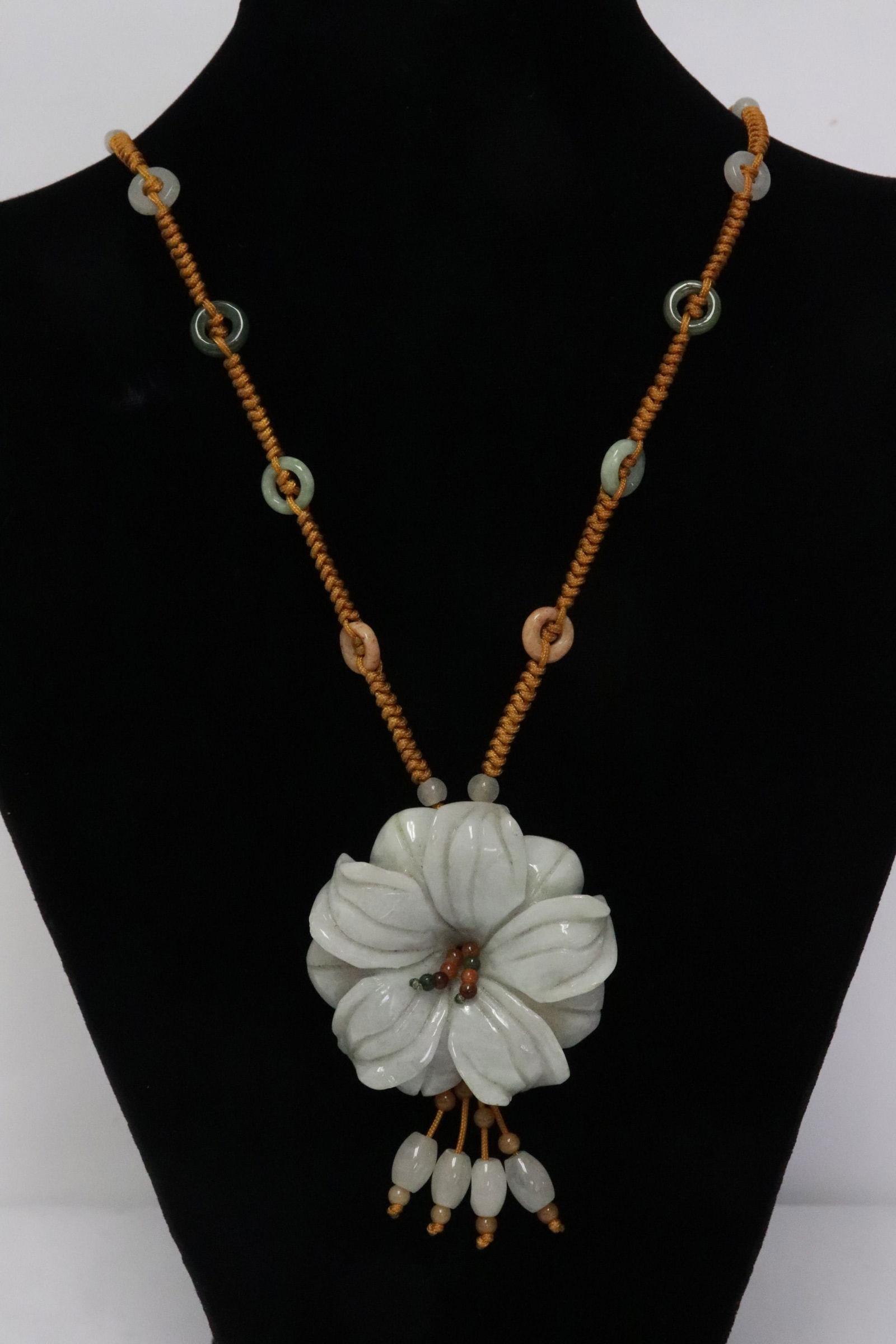 Chinese lavender jadeite carved flower w/ a necklace: Chinese lavender jadeite carved flower (2.2"x2.15"x0.6"), attached to a necklace