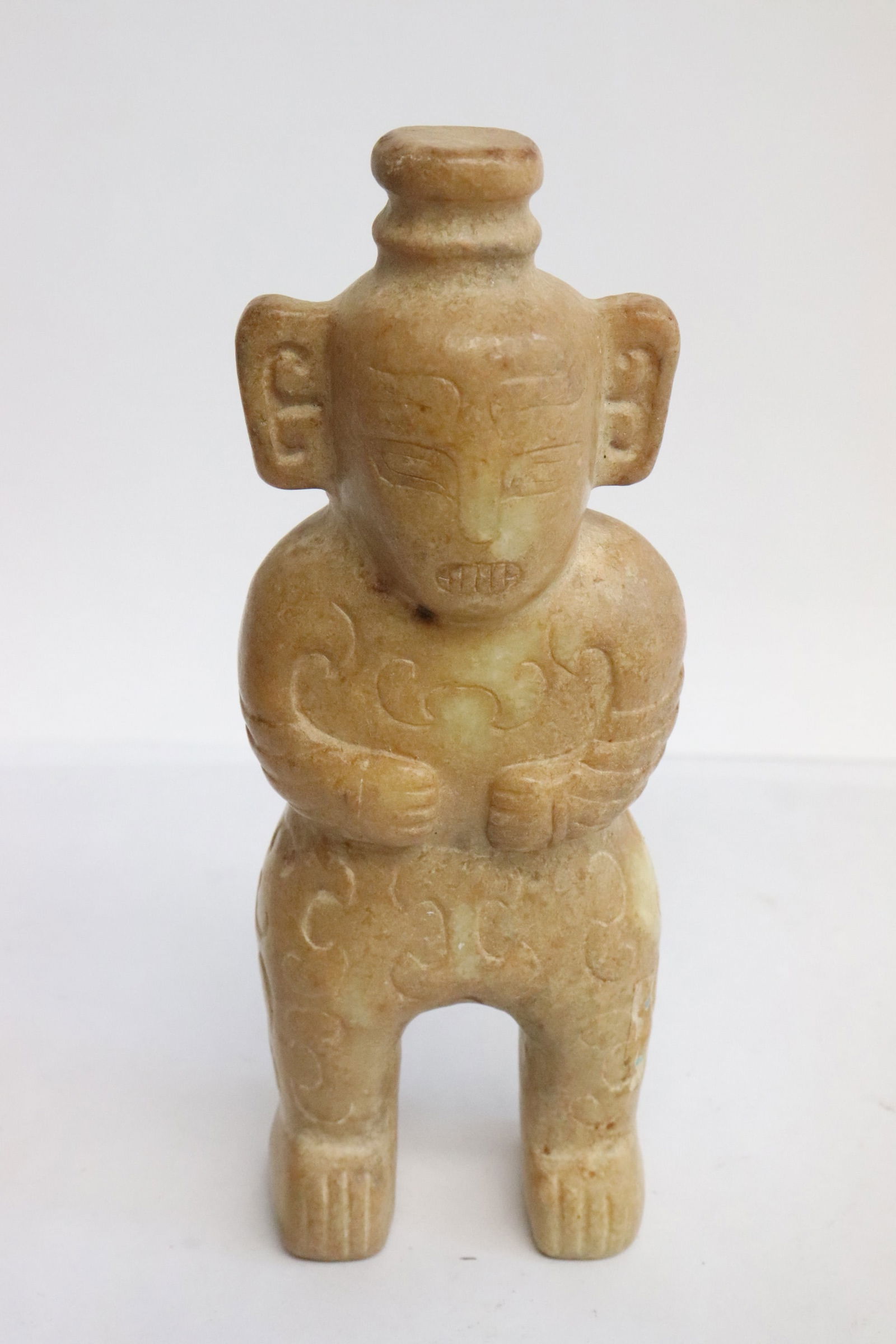 A jade like stone carved figure (1 of 5)
