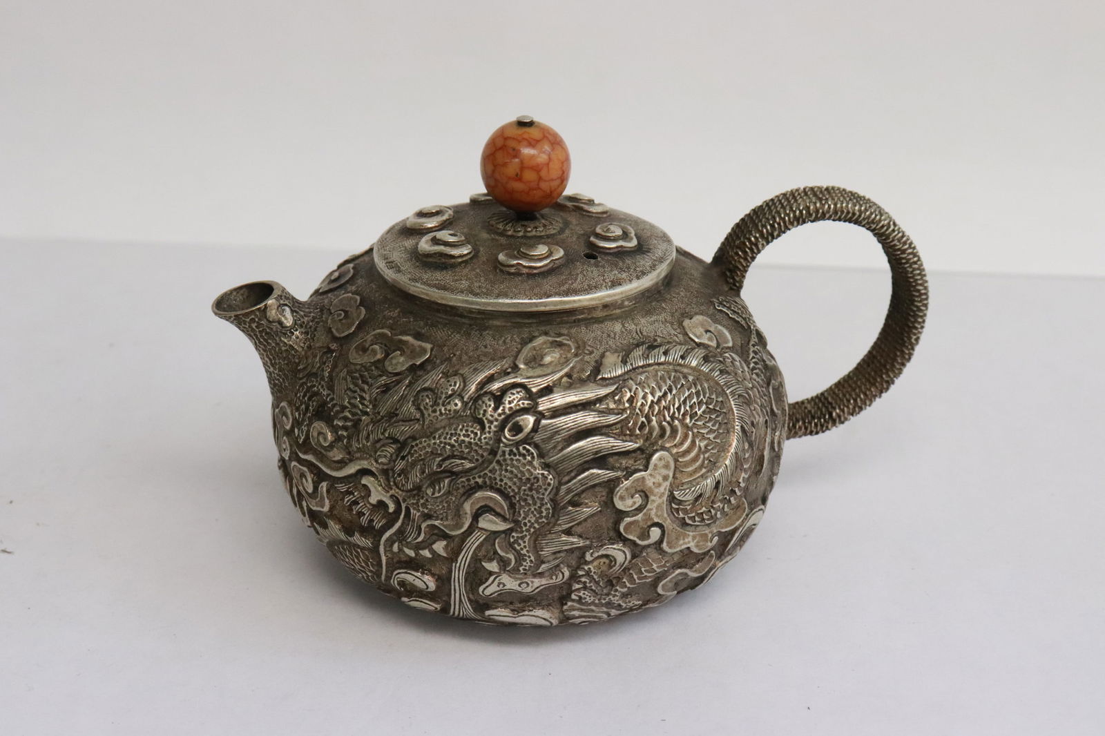 Chinese white bronze teapot: Chinese white bronze teapot with dragon motif decoration in relief, 3.2"x5"x3.65"