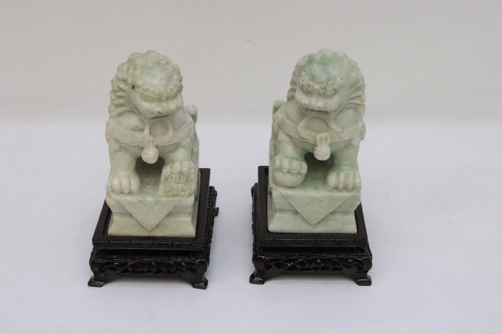 Pair Chinese jadeite like stone carved fulions (1 of 7)