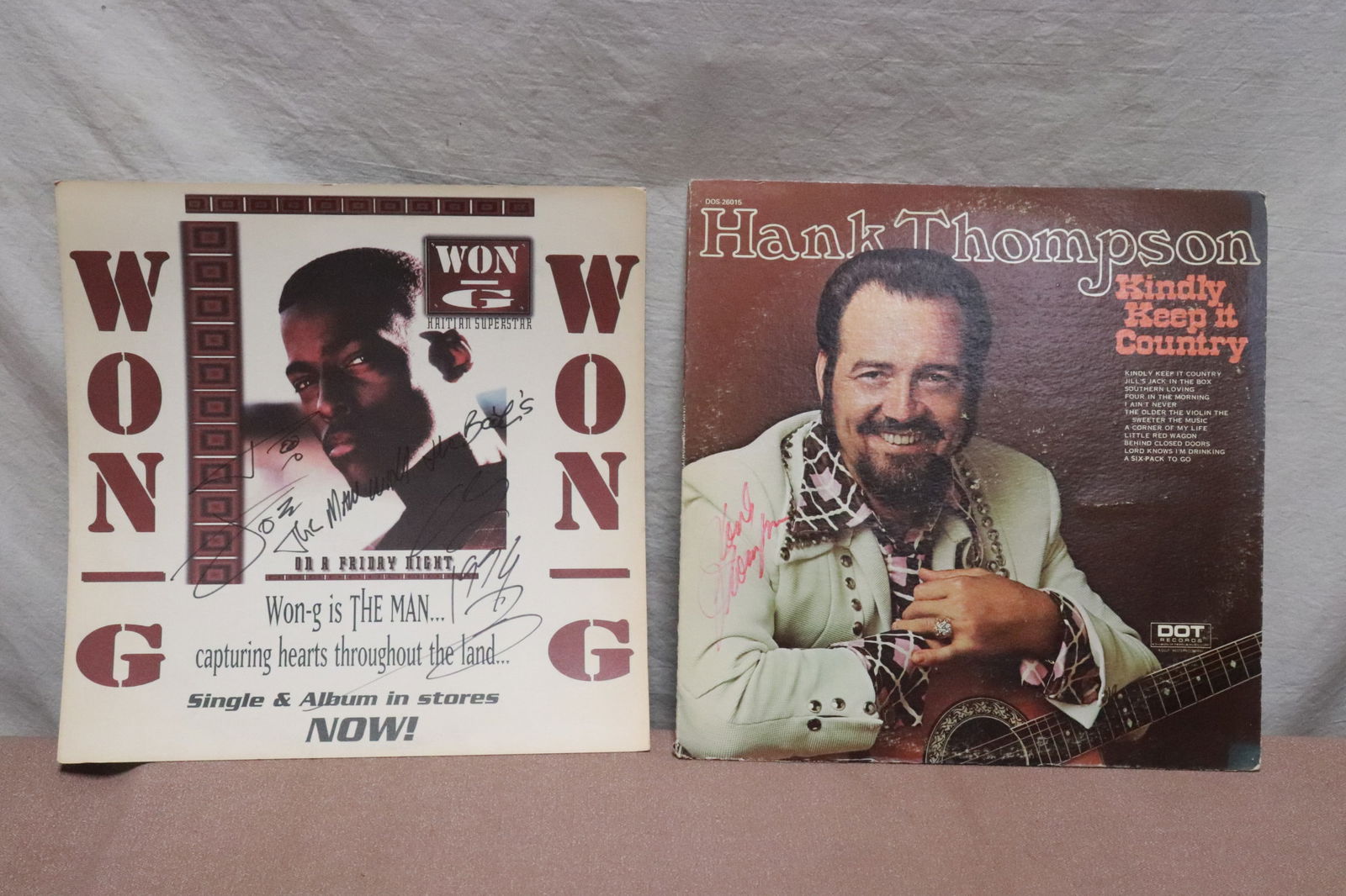 2 pieces: 2 pieces; record signed by Hank Thompson, and a promotion poster signed by "Wong"