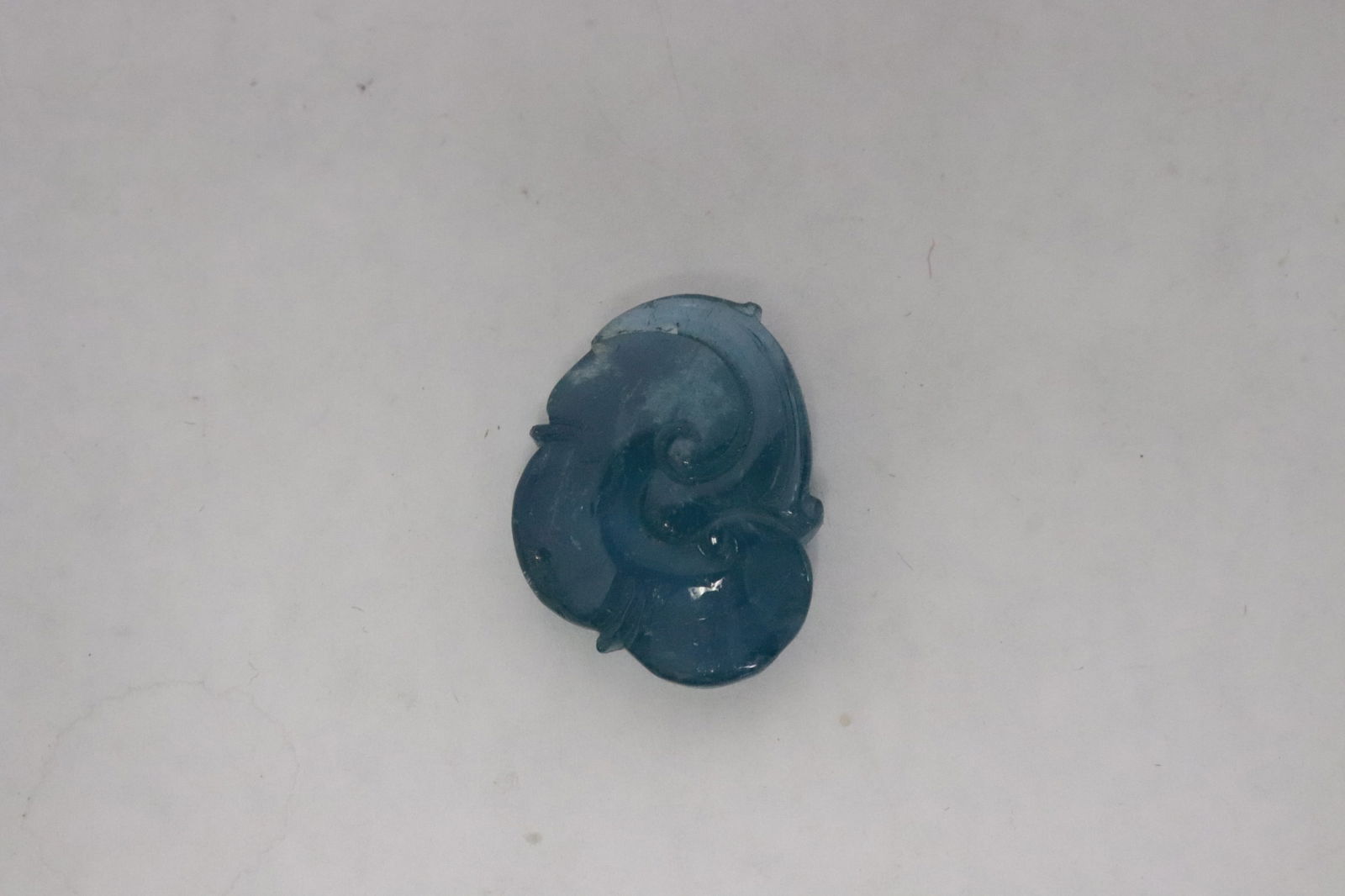 Fine aquamarine carved ornament: Fine aquamarine carved ornament, 1"x0.75"x0.35"