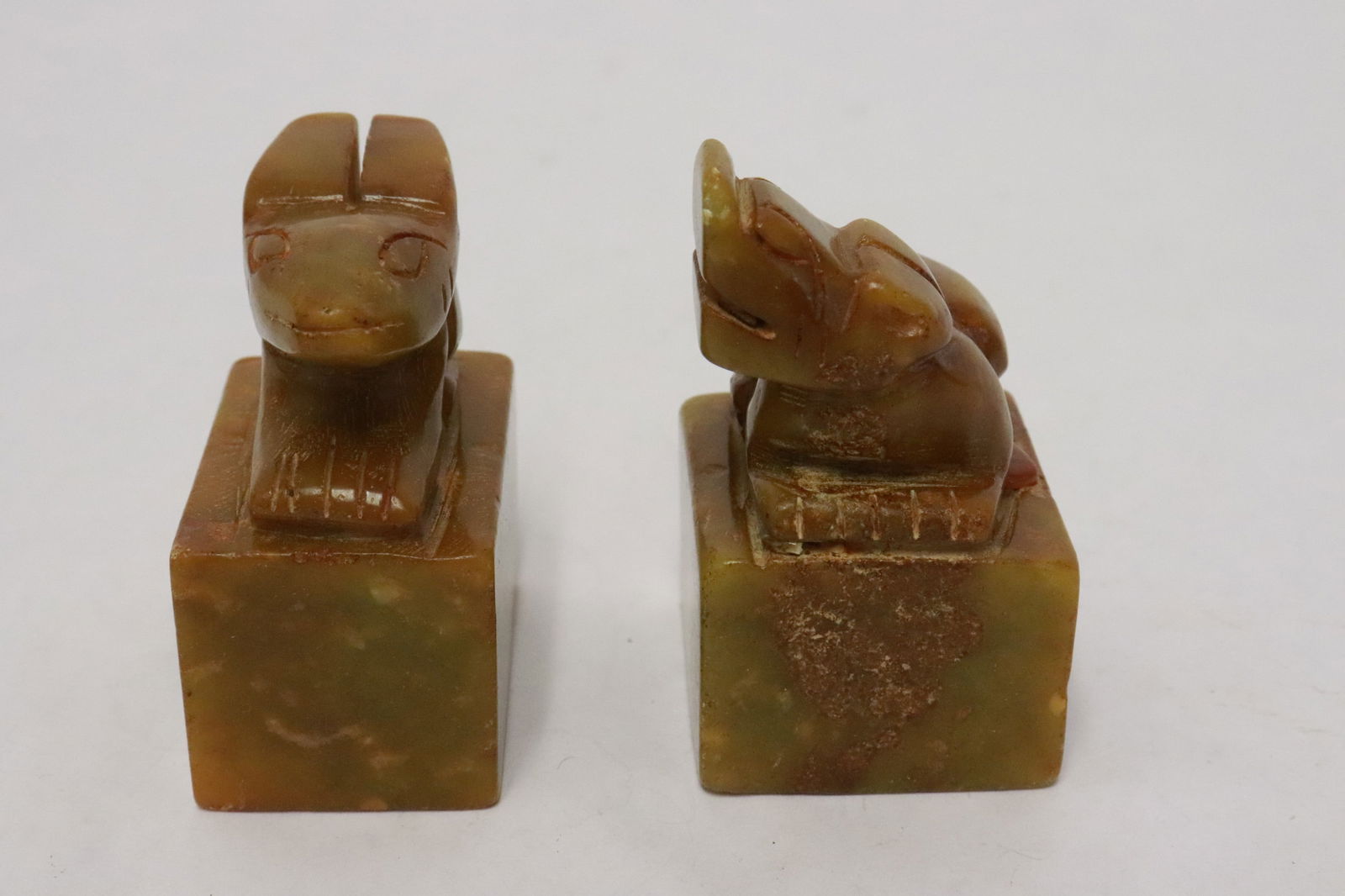 2 stone seals: 2 stone seals, 2.25"x1.18"x1.75", 2.6"x1.6"x1.35"