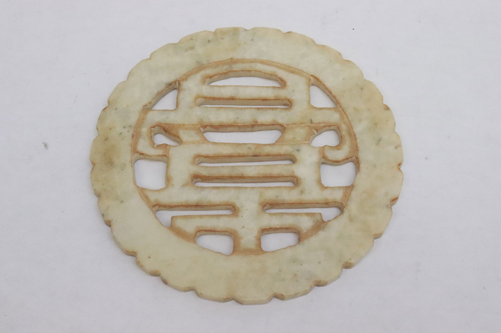 Pair jade like stone discs - 2