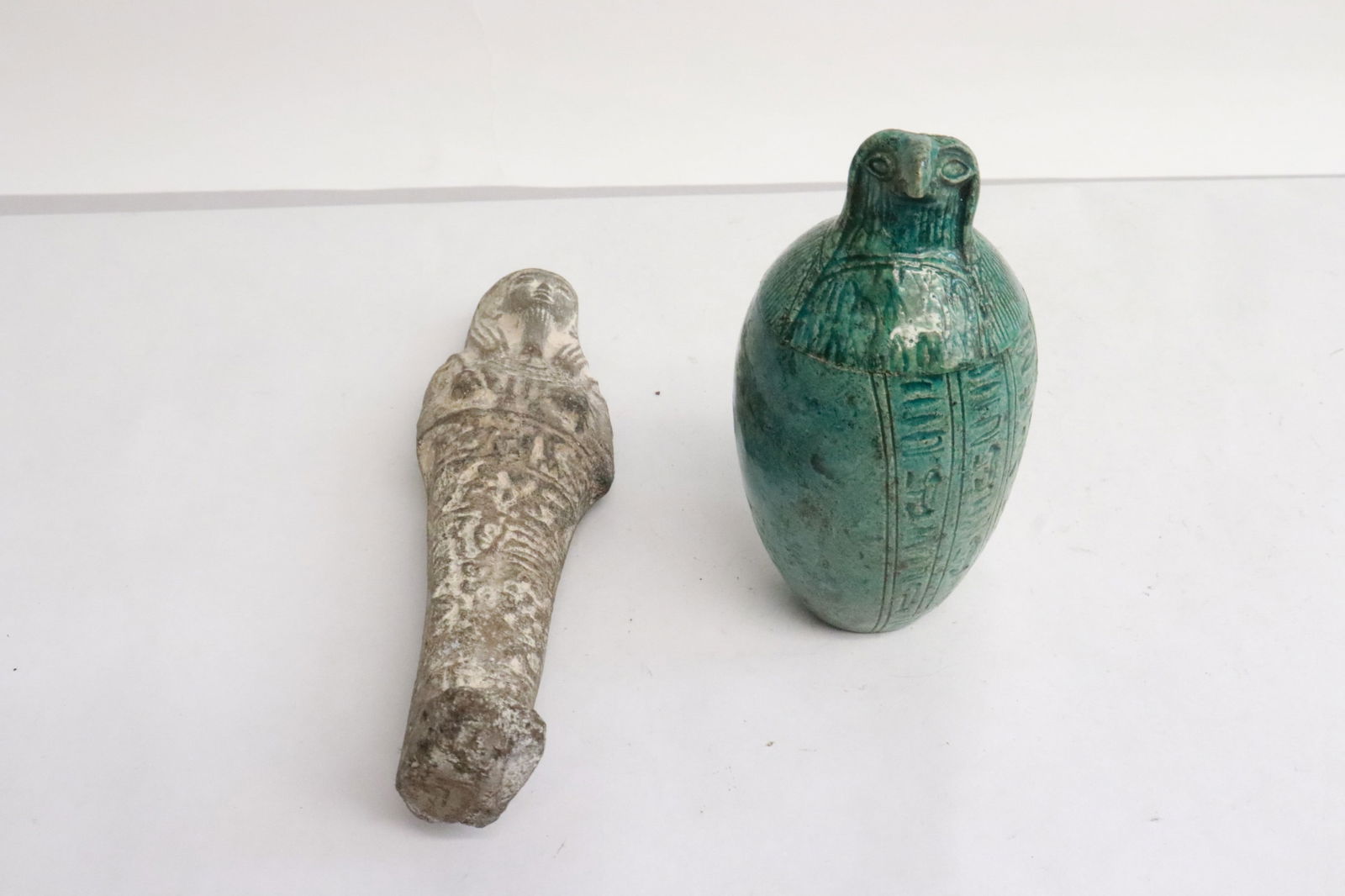 a covered vase, & a reproduction of mommy motif ornament: Green vase with cover in bird motif (4.3"x2.35"dia), and a reproduction of Egyptian mommy motif ornament (6.5"H)