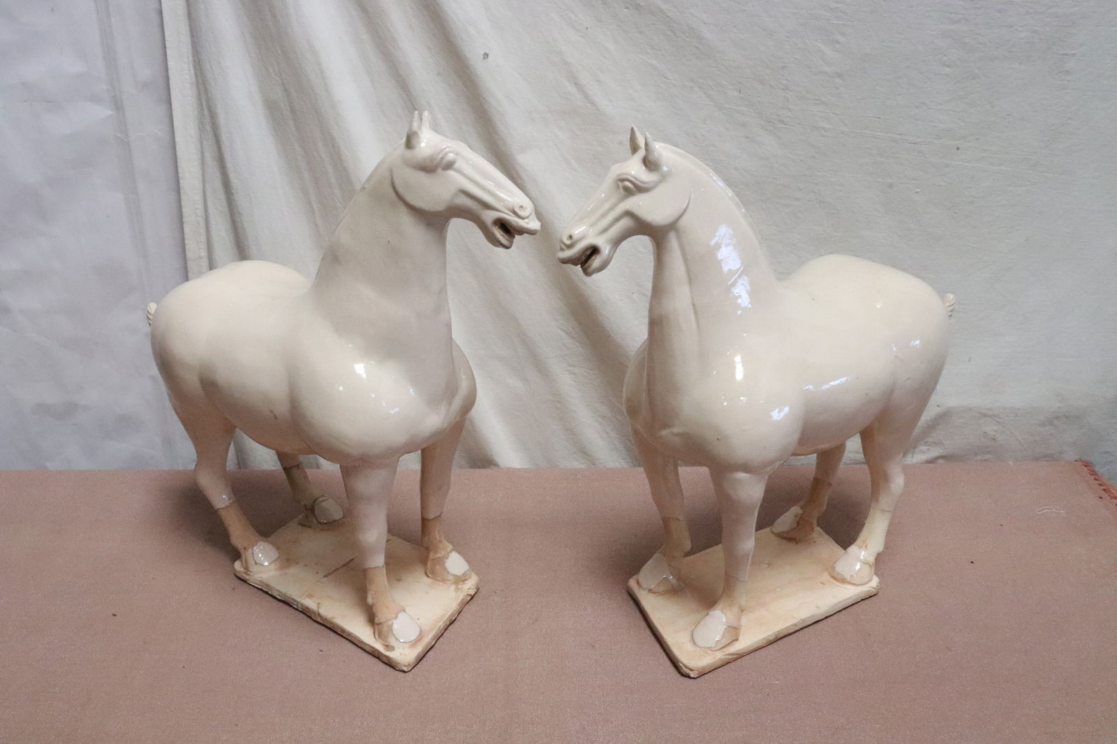 Pair Chinese large white glazed earthenware sculpture: Pair Chinese large white glazed earthenware sculpture of horses, 19.35"H, 19.8"H