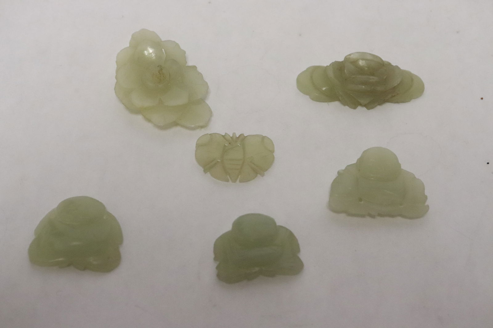 Five 19th century Hetian jade ornaments: Five 19th century Hetian jade ornaments, 0.7"H - 0.4"x1.6"x1"