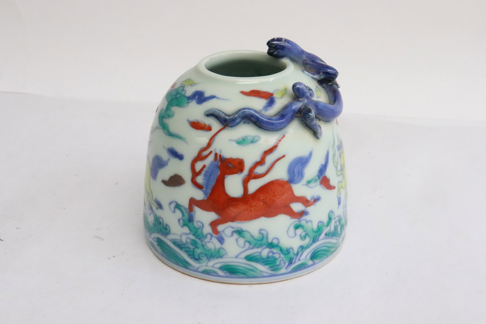 Chinese doucai porcelain water dripper: Chinese doucai porcelain water dripper with qilin motif decoration on rim, 3.35"x3.35"dia