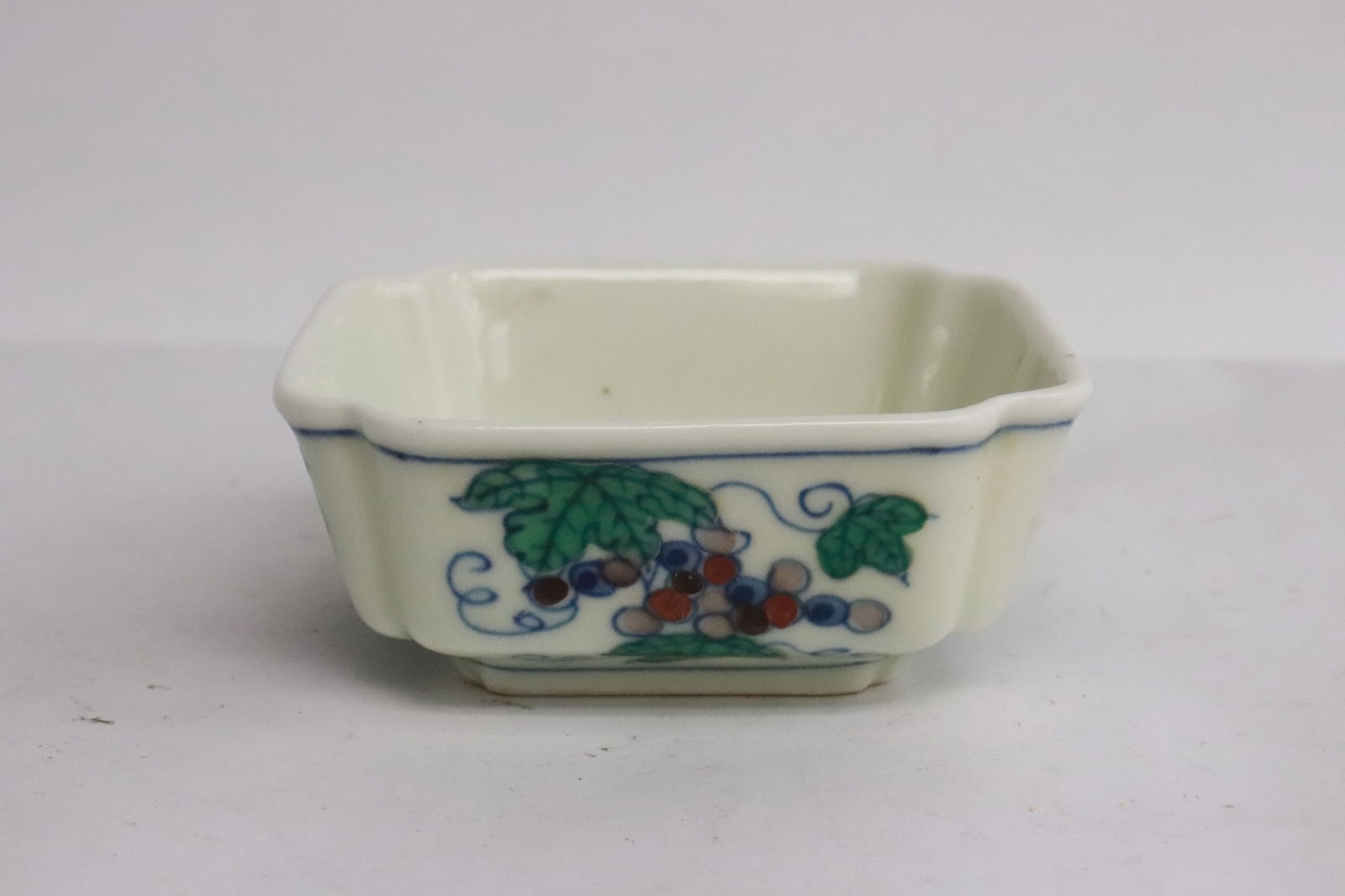 A small doucai porcelain dish: A small doucai porcelain dish, 1.3"x3.2"x3.2"