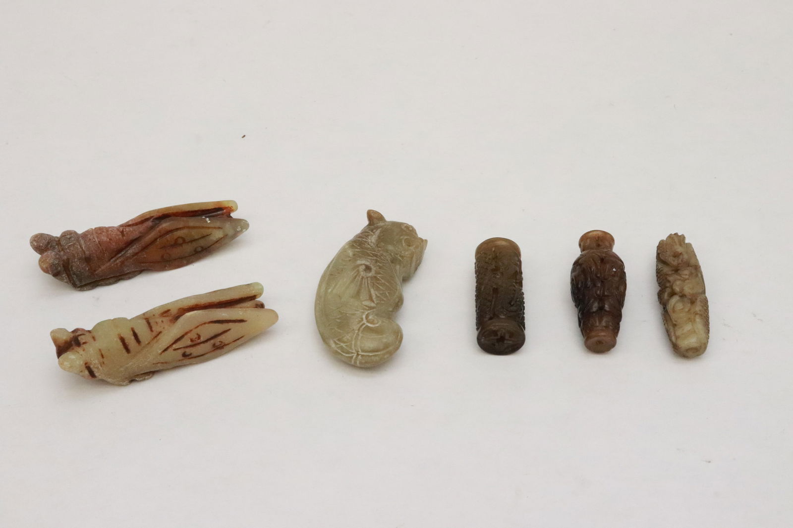 6 jade like carvings: 6 jade like carvings, 1.6"x0.64"dia - 2.75"x0.7"x0.75"